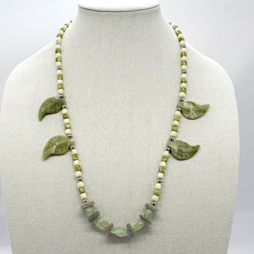 Jade color natural stone necklace with leaves stone accents.